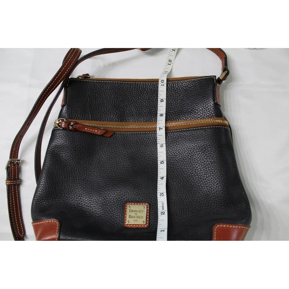 Dooney & Bourke Black Pebbled Leather Crossbody Bag with Tan Trim and Red Lining